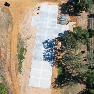 concrete slab foundation for 50x235 metal building near Columbus Texas